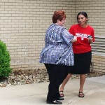 Republican Committee Chairman Megan Carpenter reminding one of Commissioner Nichols’ supporters about the laws covering political poll workers / photo by John Paul